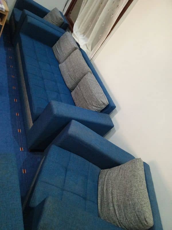 blue coloured sofa in good condition used 3