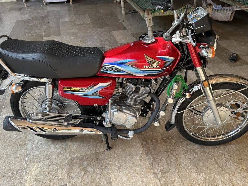 honda 125 fresh condition nowshera rajistar 2