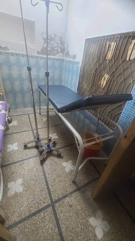 All clinical equipment for sale. couch, dr table, reception table, etc 1