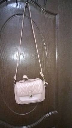 cross body bag peach color with out any scratches