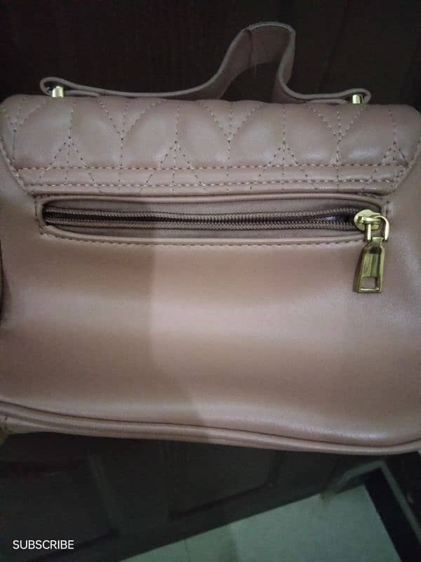 cross body bag peach color with out any scratches 2