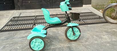 kids trycycle  for sale look like little bit used