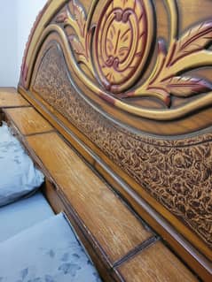 Wooden double bed with mattress