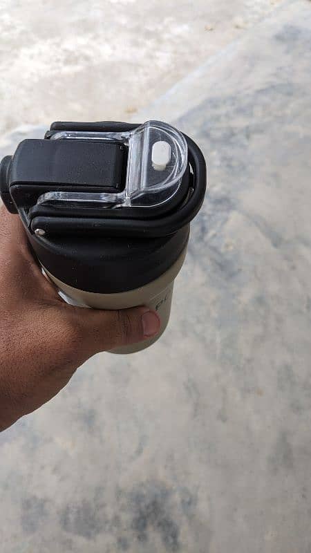 Hand holding Thermos hot and Cool 1