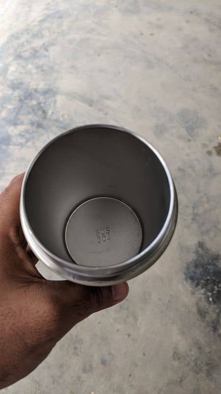 Hand holding Thermos hot and Cool 3