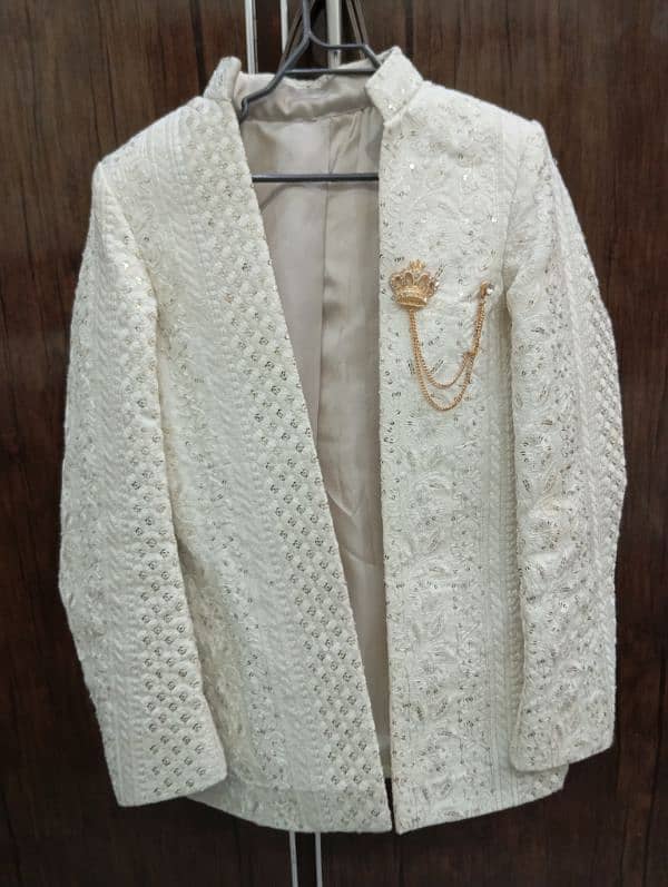 prince coat with golden brooch. 1