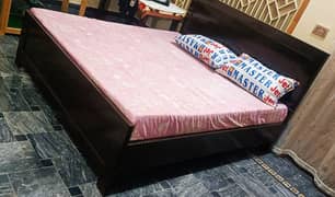 double bed almost new wooden bed with foam