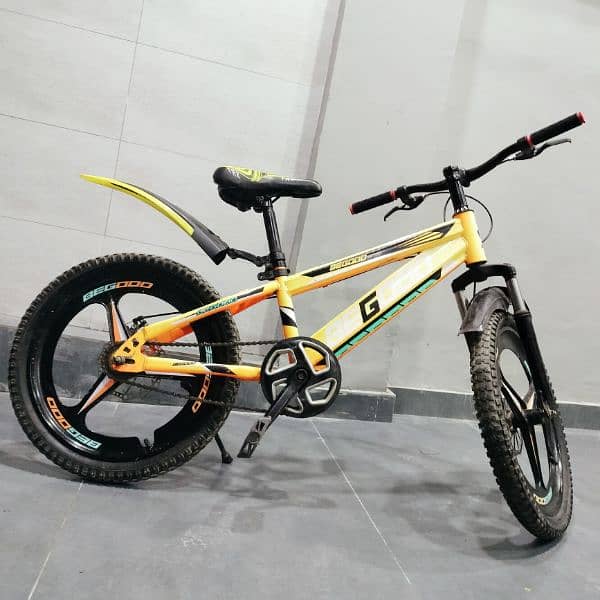 medium size bicycle orange colour 0