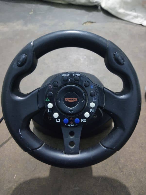 playstation 2 steering wheel and acceleratot pedals 0