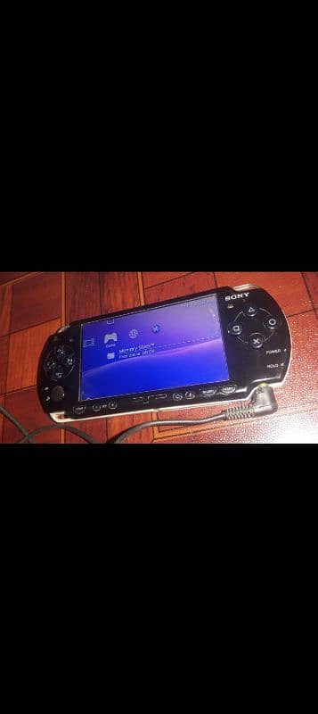 PSP 2000 WITH GAMES BATTERY AND CHARGER 0