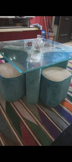 table with 4 stools for kids.