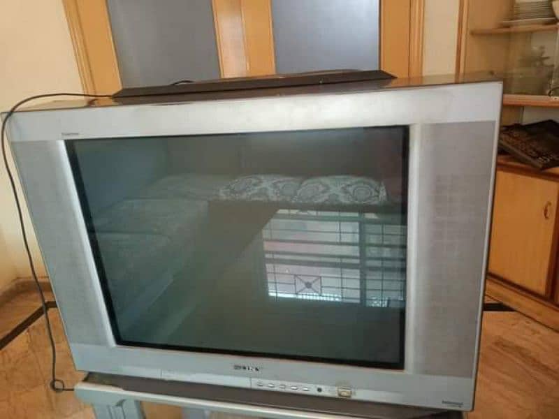 T. v with speaker and remote 0