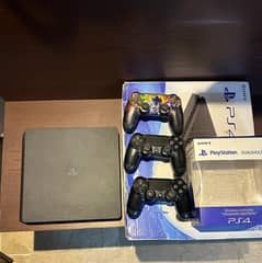 PS4 SLIM with 3 controllers and 4 games