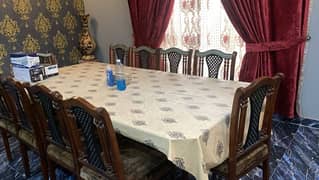 10 seater dining table, glass top and wooden chairs