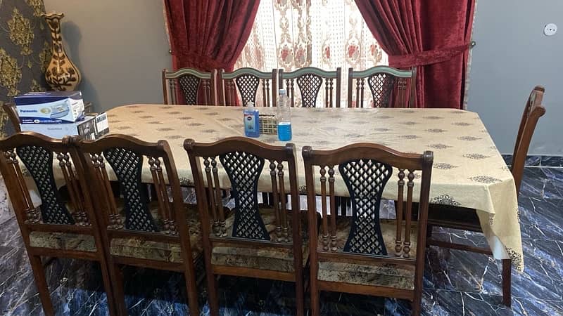 10 seater dining table, glass top and wooden chairs 1