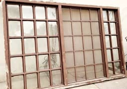 Sliding wooden window with steel grill