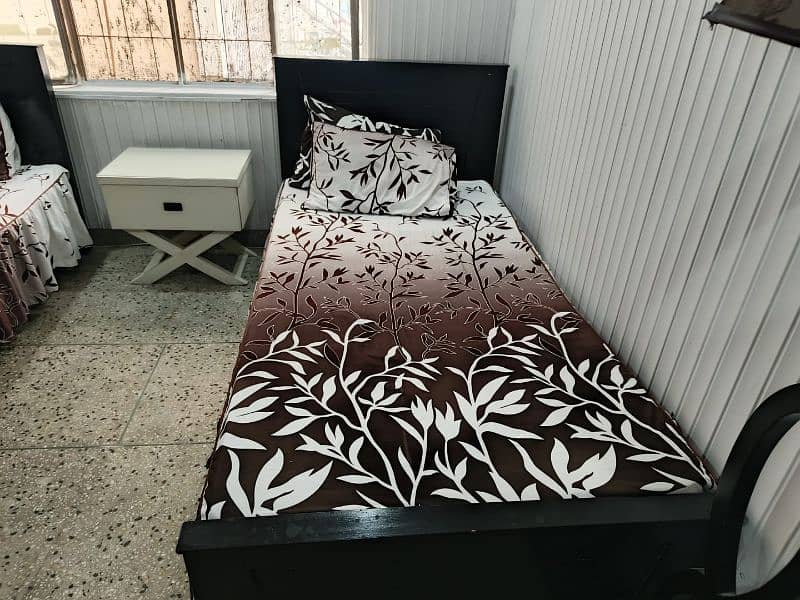 Single bed with side table 0