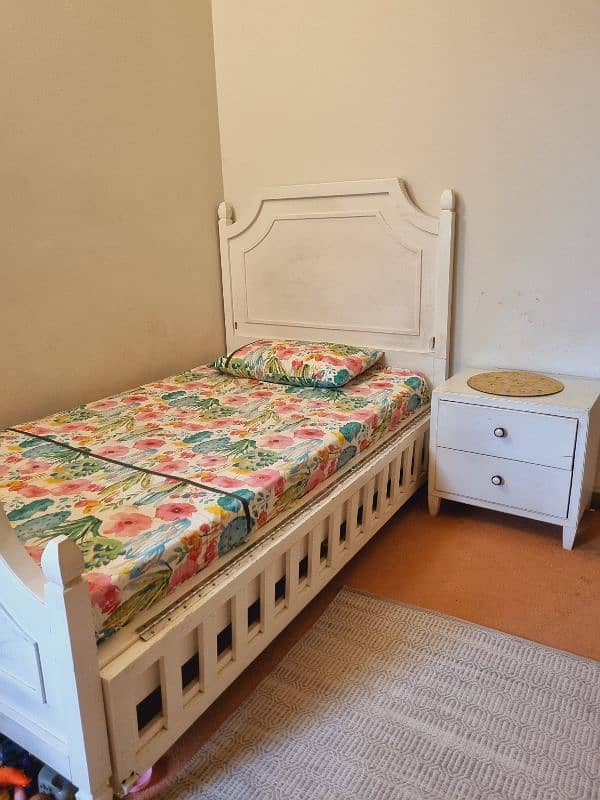 single bed with side table 0