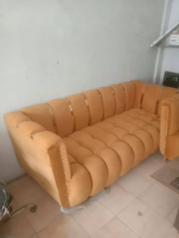 yellow colour sofa 3peses and 1tibal 1