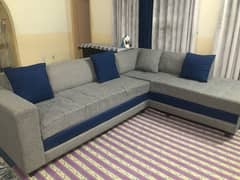 blue and grey L shaped sofa