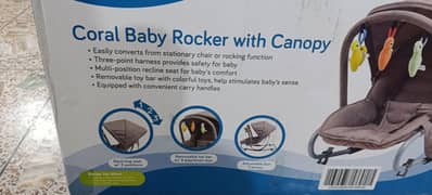 Junior's coral baby rocker with canopy