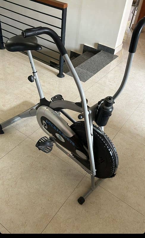 Elliptical cycle exercise cycling machine magnetic air bike Fan spin 1