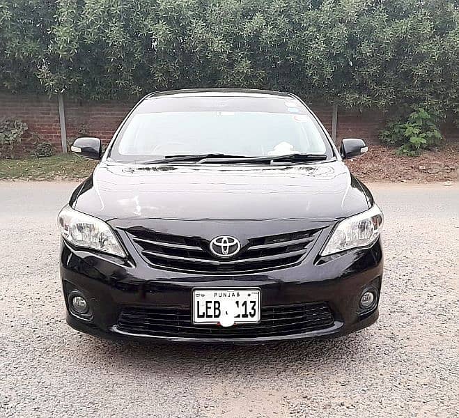 Corolla XLI 2014 converted GIi 1.3 CC Manual Gear, Lahore number. 1