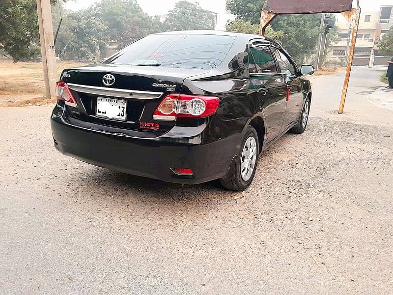 Corolla XLI 2014 converted GIi 1.3 CC Manual Gear, Lahore number. 8