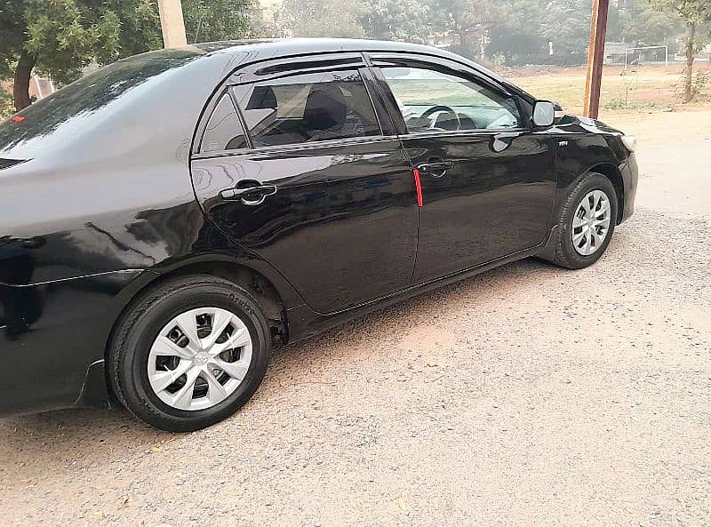 Corolla XLI 2014 converted GIi 1.3 CC Manual Gear, Lahore number. 9