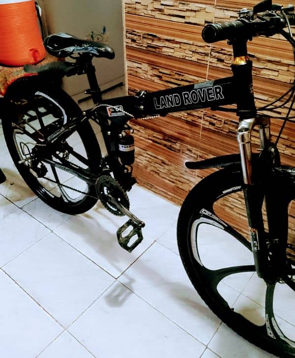 bicycle folding 26 inch brand new 5 month used dual suspension 1