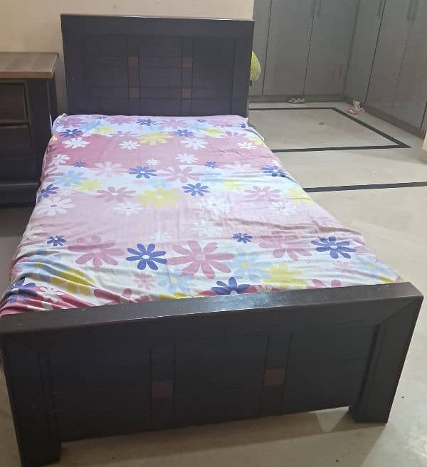 2 single beds with side table in good condition with reasonable prices 0