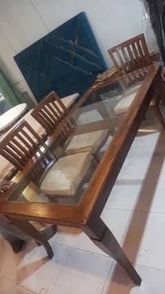 wooden dinning table with 6 chairs for sale table size is 42x78.