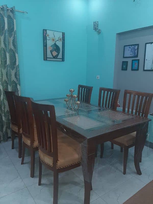 wooden dinning table with 6 chairs for sale table size is 42x78. 1