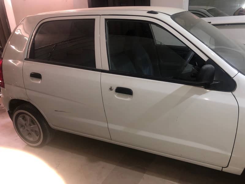 white suzuki alto 4