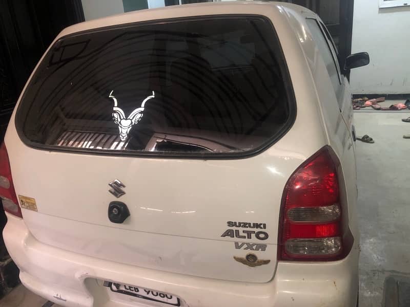 white suzuki alto 5