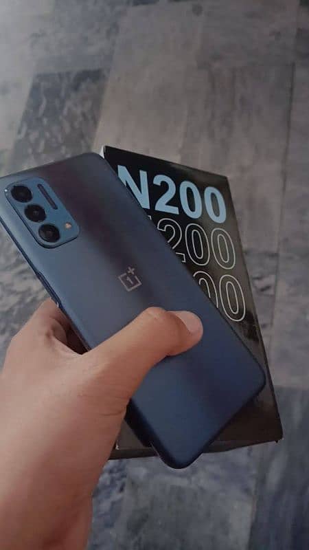 OnePlus n200 with unofficial box charger 10/10 lush condition 2