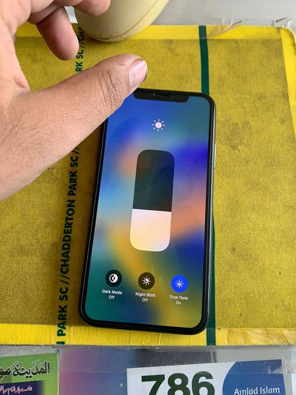 Iphone x pta 77 battery health water pack 6 month se chla rha bht vip 0