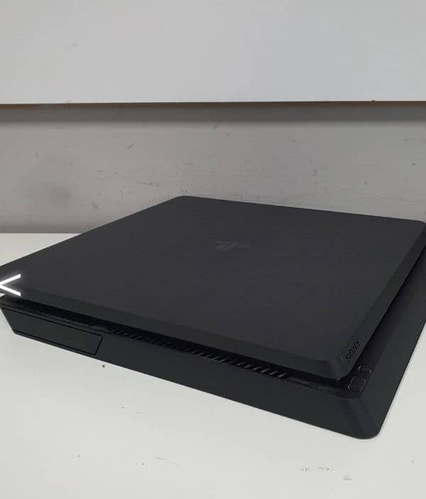 PS4 1 tb only 1 month used with 2 controller and taken 7 6