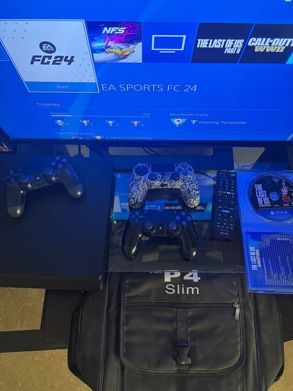 PS4 Slim 1TB with 5 games and 3 controllers + 32 inch Tv + Desk 5