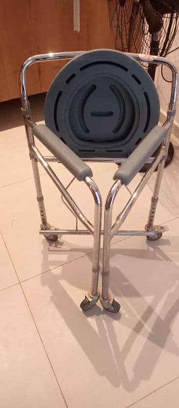 I am selling commode chair in very good condition 3