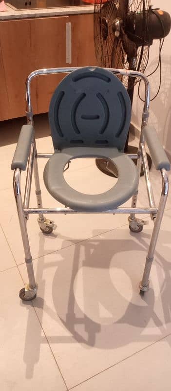 I am selling commode chair in very good condition 5