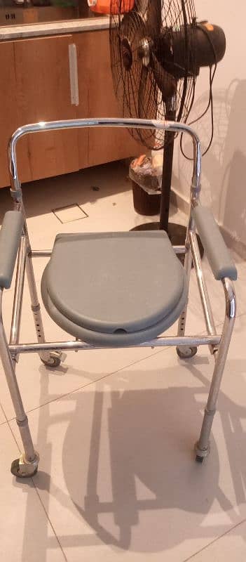 I am selling commode chair in very good condition 7