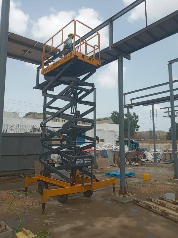 42 Feet Scissor Lift Available For Rent on Daily Basis in all Pakistan 14