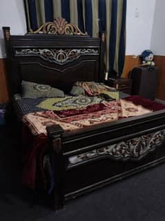 double bed with side tables and dressing tables