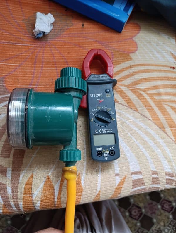 Clamp meter and automatic timer device for gardening water 1