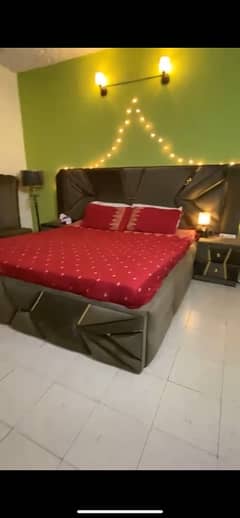 king size bed with dressing table and 2 single sofas with tea table