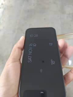 Google Pixel 8a with charger and cover