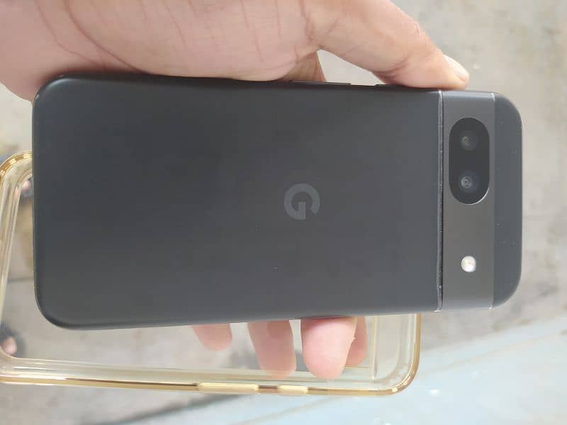 Google Pixel 8a with charger and cover 2