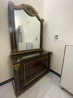 wooden bed with side tables and dressing table