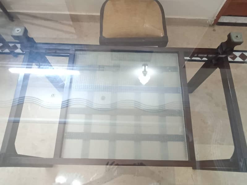 Wooden table (6 chairs) with glass top. 3